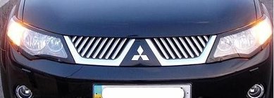 Mitsubishi Outlander 2006-2012 Stainless Steel Grille Covers (2006-2010) photo 1