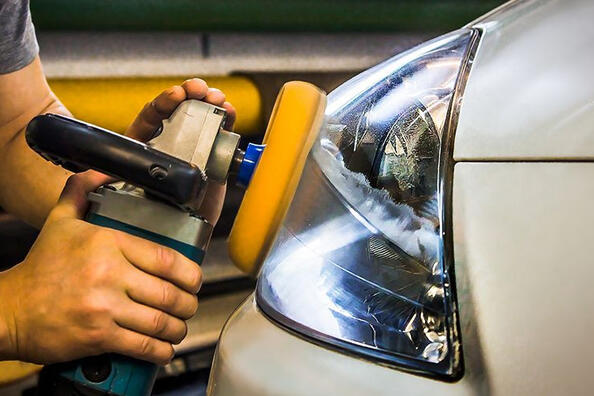 How often should the headlights be polished?