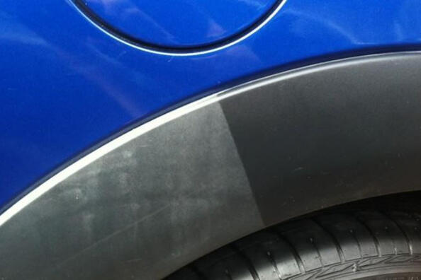 What can be used to blacken the black plastic of a car?
