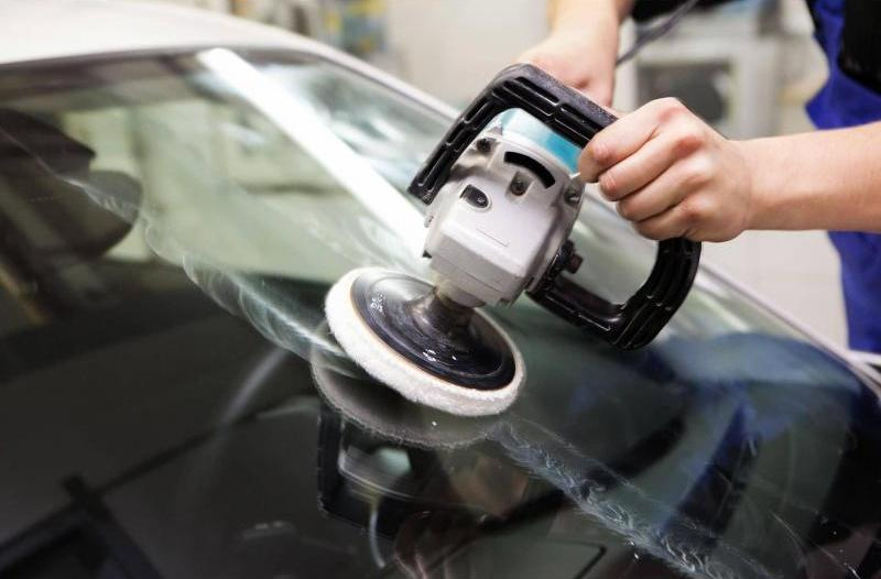 Why is it necessary to polish the windshield of the car?