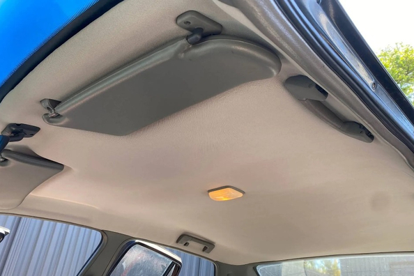 What material should be used to cover the ceiling of a car?