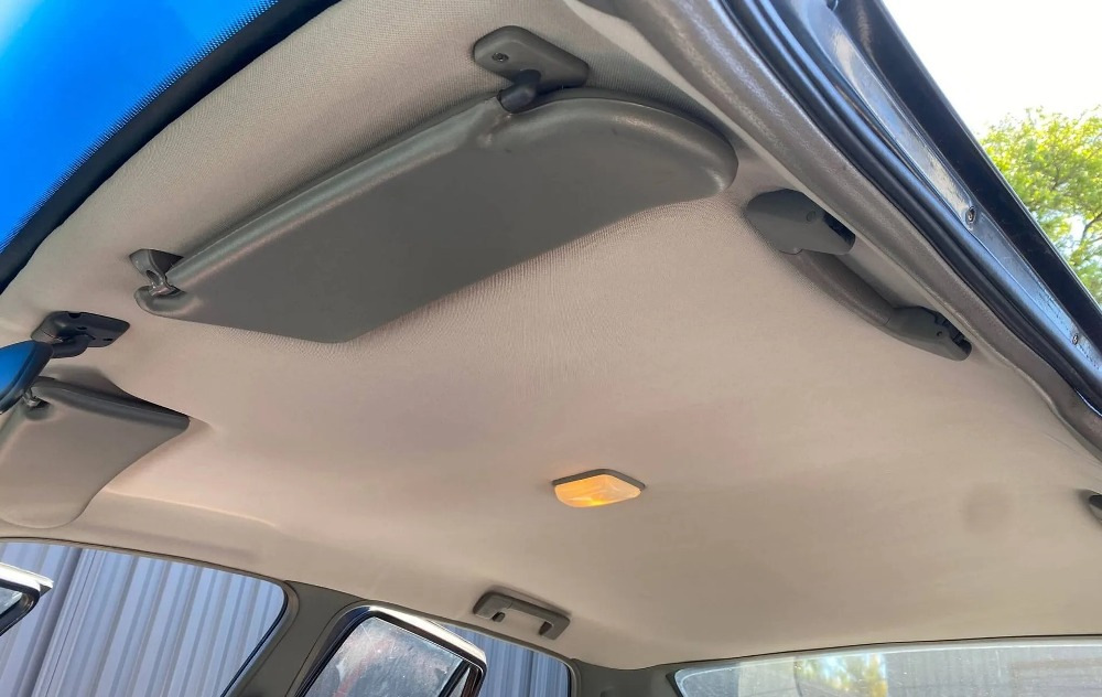 What material should be used to cover the ceiling of a car?