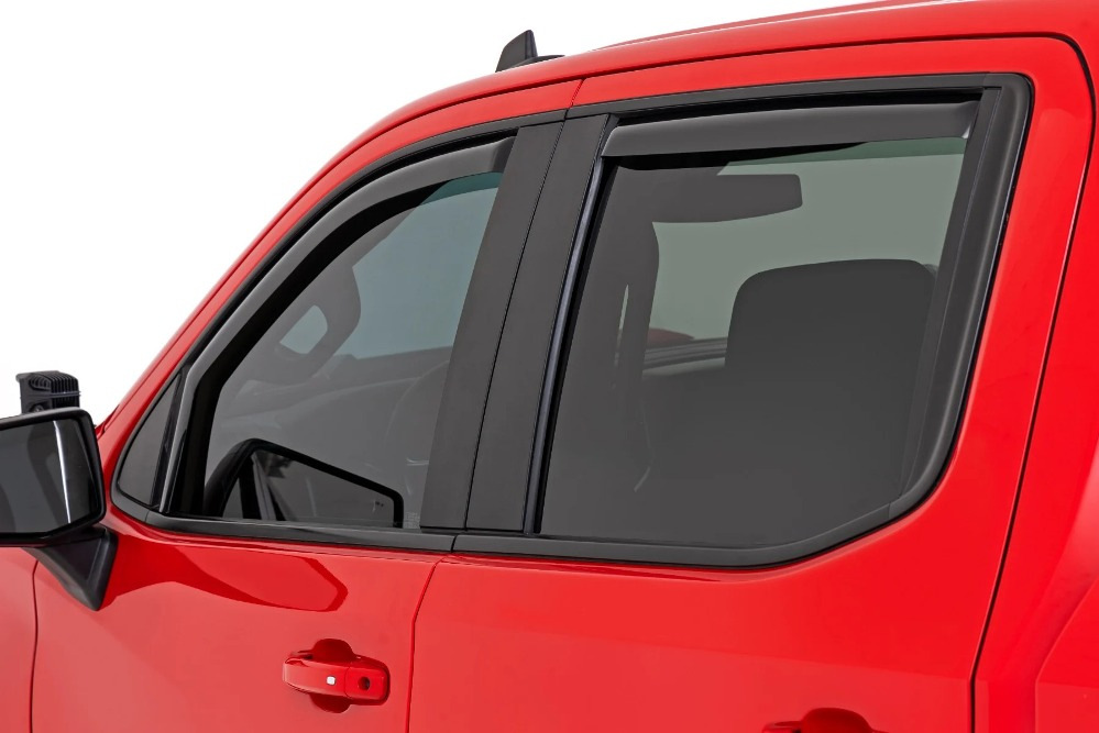 What is the function of wind deflectors on car windows?