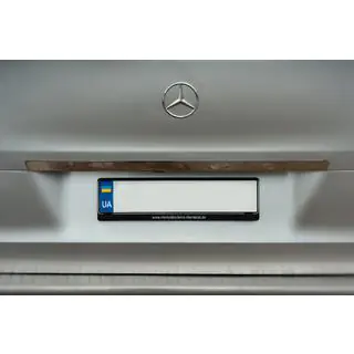 Wide stainless steel tailgate trim above license plate photo 1