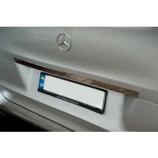Wide stainless steel tailgate trim above license plate photo 2
