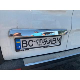 Stainless steel trim above license plate photo 4