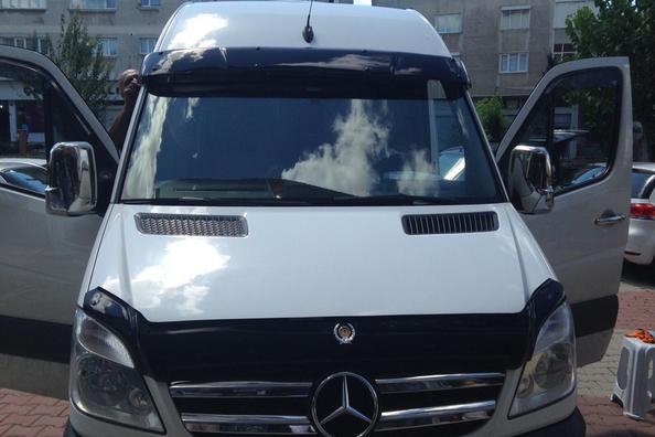 Install the deflector on the windshield