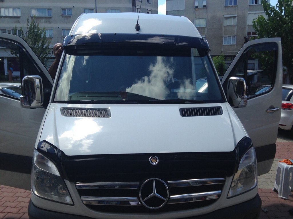 Install the deflector on the windshield