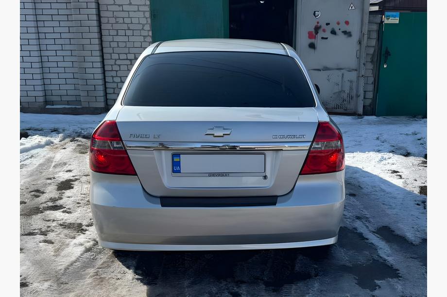 Chevrolet Aveo T250 2005-2011 Rear bumper protector with lip Plastic Gloss, Sedan - 4-Door Photo 1