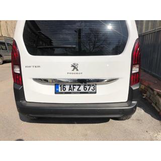 Stainless steel trim above license plate photo 3