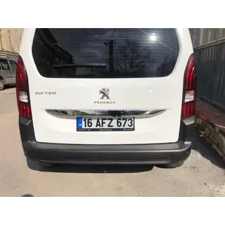 Stainless steel trim above license plate photo 3