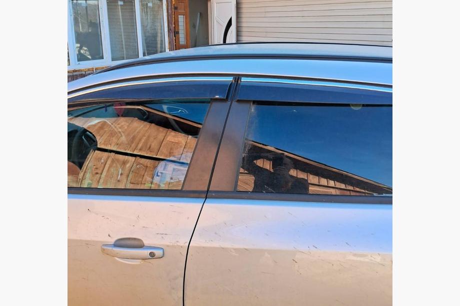 Opel Astra J 2009-2015 Chrome Window Deflectors with Strip HB/SD (4 pcs, Sunplex Chrome) Image