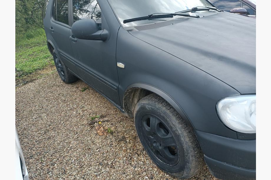 Mercedes ML W163 1997-2005 Fender flares (4 pcs, black, ABS plastic) Photo 2