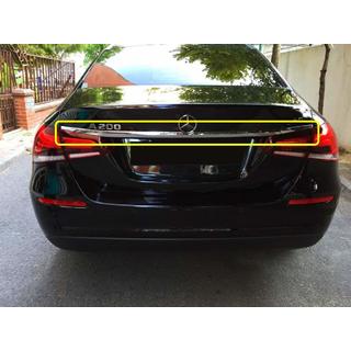 Stainless steel trim above license plate photo 1